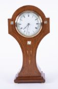 An Art Nouveau mahogany and mother of pearl inlaid mantle 'waisted' clock, French movement, with