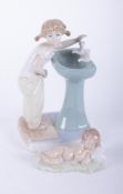 Lladro, figure of a child at the sink and another, 20cm.