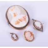 Four cameo brooches/pendants of various metal and sizes, one stamped for 9ct & one