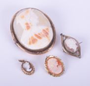 Four cameo brooches/pendants of various metal and sizes, one stamped for 9ct & one