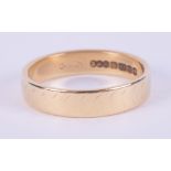 An 18ct yellow gold wedding band, 3.30gm, size L.