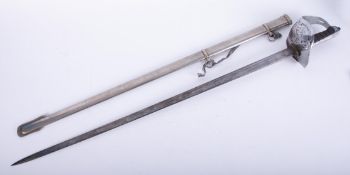 A QE2 Wilkinson sword & scabbard with etched blade, Royal Cypher, pierced basket hilt, shagreen