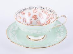 A Paragon china fortune tellers cup and saucer.