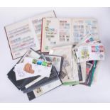 A collection of various British and world stamps, covers, stamp albums, some postcards and cigarette