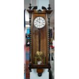 A Vienna type walnut and mahogany cased wall clock, with train movement, swan neck pediment,