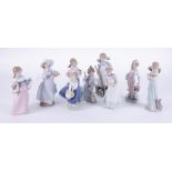 Lladro, a collection of nine figurines, tallest height 22cm.