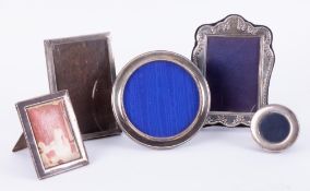 Five assorted silver photo frames, including circular model, 14cm diameter.