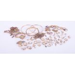 A mixed bag of 9ct yellow gold jewellery items including earrings, lockets, chain,