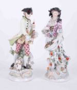 A pair of 19th Century Vienna porcelain figures one depicting a bagpipe player in period costume