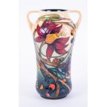 Moorcroft, a modern patterned vase, twin handled, monogrammed, dated 2002, decorated with flowers,
