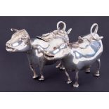 Two similar Continental silver cow creamers, indistinct hallmarks, length 14cm,10.55oz.