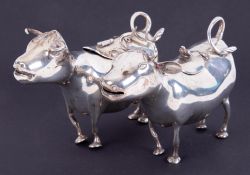 Two similar Continental silver cow creamers, indistinct hallmarks, length 14cm,10.55oz.