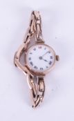 A vintage ladies 9ct gold cased wristwatch, mechanical movement with red twelve dial, approx. 23.
