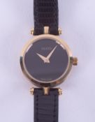 Gucci, a ladies Gucci 'stacked' wristwatch with a black dial and a black & gold banded stacked case,