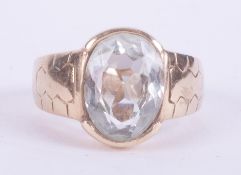 A 9ct yellow gold ring set with an oval mixed cut aquamarine, approx. 4.84 carats, with engraved
