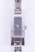 Gucci, a ladies Gucci stainless steel wristwatch with black dial, stamped on the backplate Gucci