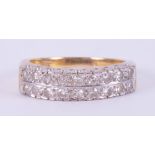 An 18ct yellow gold & platinum ring set with two rows of round cut diamonds, 6.05gm, size Q.