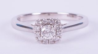 An 18ct white gold ring set with 0.25 carats total weight of round brilliant cut diamonds in a