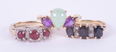 Three 9ct yellow gold rings to include one set with a pear cut cabochon jade & two pear cut