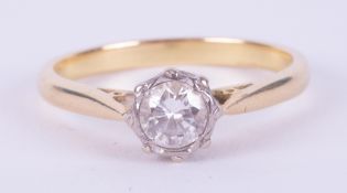 An 18ct yellow gold & platinum ring set with a round brilliant cut diamond, approx. 0.40 carats (