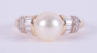 An 18ct yellow gold ring (not hallmarked or tested) set with a central cultured pearl,