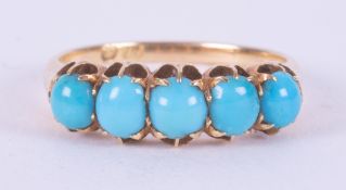 An 18ct yellow gold ring set with five oval cabochon cut turquoise stones, 3.08gm, size N.