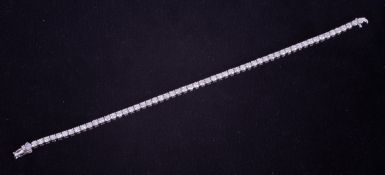 An 18ct white gold line bracelet set with approximately 5.22 carats of round brilliant cut diamonds,