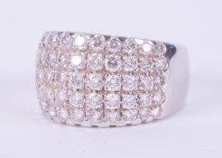 An 18ct white gold ring with five rows set with round brilliant cut diamonds, 10.31gm, size K 1/2.