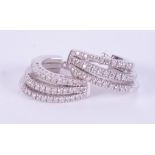 A pair of 18ct white gold three row creole style earrings set with small round brilliant cut