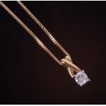 An 18ct yellow & white gold twist top design pendant set with a 0.25 carat round brilliant cut