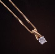 An 18ct yellow & white gold twist top design pendant set with a 0.25 carat round brilliant
