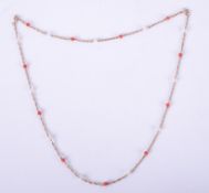 A 9ct yellow gold 22" twisted chain interspaced with coral & pearls, 6.50gm.