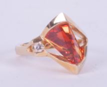 An unusual vintage designer 14k yellow gold ring by Strell (Strellman) set with a fantasy cut orange