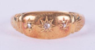 A yellow gold antique ring (no hallmarks & not tested) set with three old cut diamonds in a gypsy