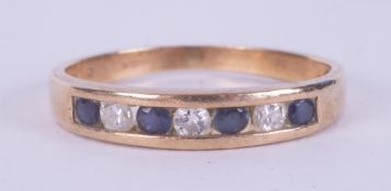 A 9ct yellow gold half eternity ring set with a mixture of round brilliant cut diamonds and round