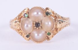 An antique yellow gold ring (not hallmarked or tested) set with pearls & small round cut emeralds,