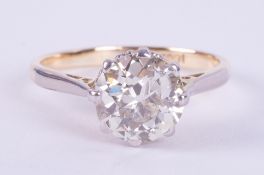 An 18ct yellow gold & platinum solitaire ring set an older round cut diamond, approx. 2.00 carats,