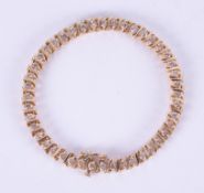 A 14k yellow gold line bracelet set with approximately 2.58 carats of round brilliant cut
