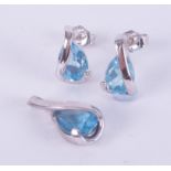 A 9ct white gold set to include a 9ct white gold pendant set with a pear shaped blue topaz and a