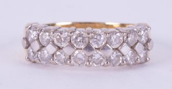 An 18ct yellow gold & platinum (not hallmarked or tested) two row ring set with round brilliant