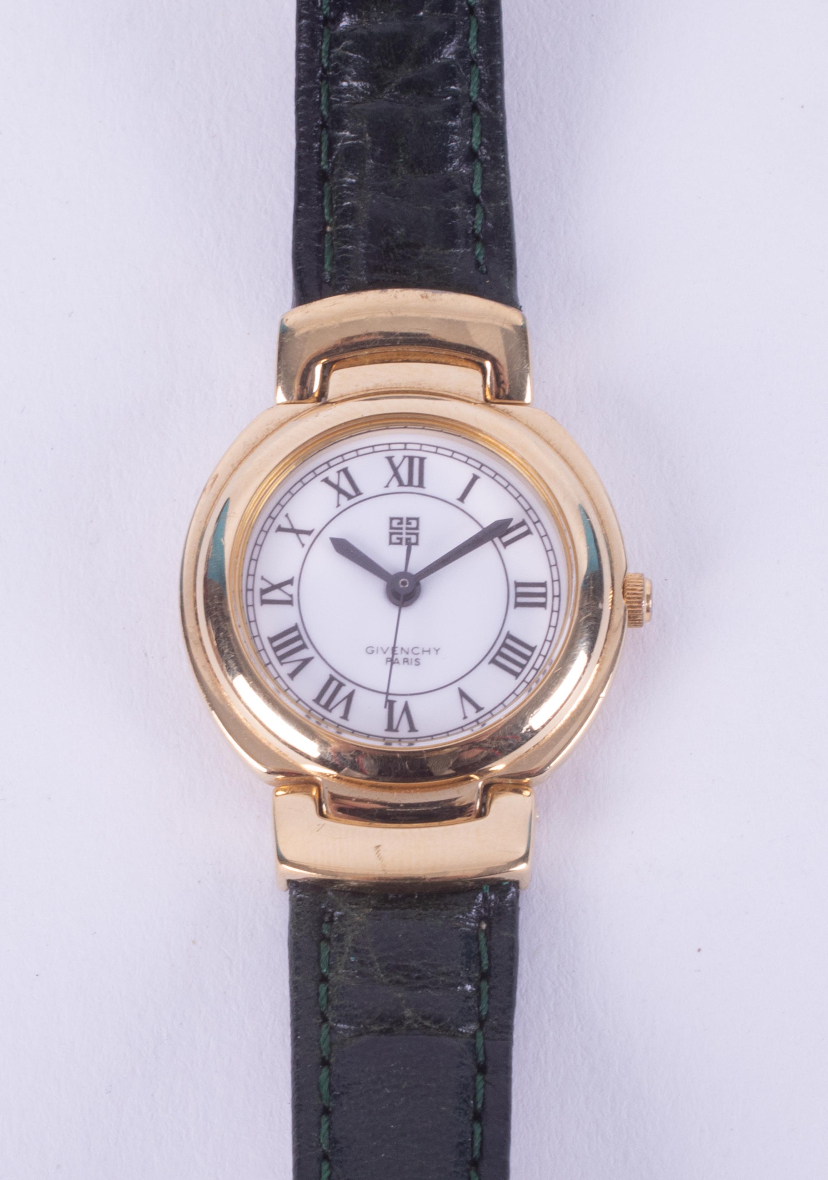 Givenchy Paris, a ladies Givenchy wristwatch with a gold tone case, stamped on the backplate '