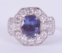 An impressive 18ct white gold ring set with a central oval cut sapphire, approximately 2.00