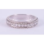 A 9ct white gold half eternity ring with rope twist design edges and set with approx. 0.34