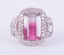 An 18ct white gold ornate style ring set with an emerald cut bi-colour tourmaline, approx. 4.10