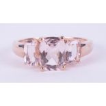 A 9ct rose gold three stone ring set with cushion cut pink Morganite , 2.53gm, size N 1/2 to O.