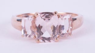 A 9ct rose gold three stone ring set with cushion cut pink Morganite , 2.53gm, size N 1/2 to O.