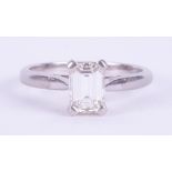 A platinum four claw ring set with 0.77 carats of emerald cut diamond, approx. colour H-I and VS2