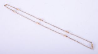 An Edwardian 9ct yellow gold chain with marquise shaped beads interspaced throughout, 30" length,