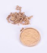 A 9ct yellow gold plain gold mount set with a George V 1915 full gold sovereign, 9.21gm, with a