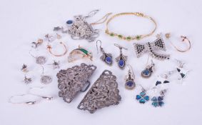 A selection of mixed silver & costume jewellery to include an ornate silver nurse's buckle, 34.79gm,